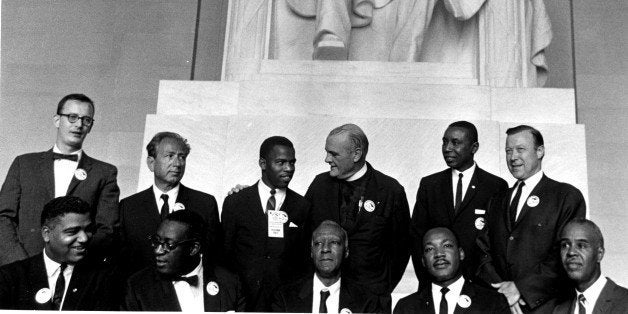 Civil Rights leaders pose in the Lincoln Memorial during the March on Washington for Jobs and Freedom, Washington DC, August 28, 1963. Pictured are, standing from left, director of the National Catholic Conference for Interracial Justice Matthew Ahmann, Rabbi Joachim Prinz (1902 - 1988), Student Nonviolent Coordinating Committee (SNCC) leader John Lewis, Protestant minister Eugene Carson Blake (1906 - 1985), Congress of Racial Equality (CORE) leader Floyd McKissick (1922 - 1991), and labor union leader Walter Reuther (1907 - 1970); sitting from left, National Urban League executive director Whitney Young (1921 - 1971), unidentified, labor union leader A Philip Randolph (1889 - 1979), Dr. Reverend Martin Luther King Jr. (1929 - 1968), and National Association for the Advancement of Colored People (NAACP) leader Roy Wilkins (1901 - 1981). The march and rally provided the setting for the Dr. King iconic 'I Have a Dream' speech. (Photo by PhotoQuest/Getty Images)