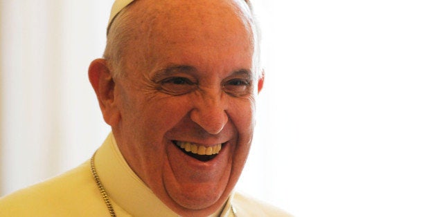 VATICAN CITY, VATICAN - AUGUST 29: Pope Francis during a meeting with King Abdullah II of Jordan and Queen Rania at the his private library on August 29, 2013 in Vatican City, Vatican. The Pope was expected to talk about Jordan's sheltering of those fleeing the civil war in neighboring Syria. (Photo by Vatican Pool/Getty Images)