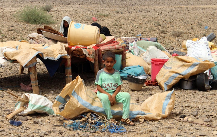 A Yemeni boy sits at an improvised camp for displaced people in the northern province of Hajjah on August 29.