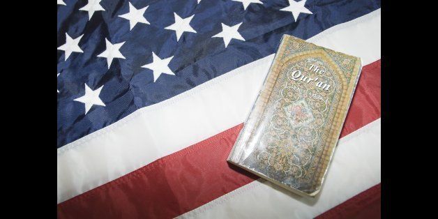 Close-up of Holy Quran on American flag.