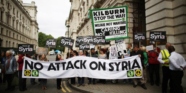 LONDON, ENGLAND - SEPTEMBER 09: Anti-war protestors demonstrate outside The Foreign and Commonwealth Office as US Secretary