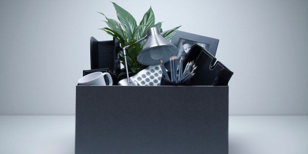 Box packed with desk objects