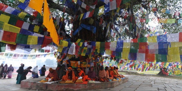 Nepalese Buddhists monks pray outside the Mayadevi (Buddha's mother) temple, birth place of Lord Buddha, Lumbini 400 kms (250 miles) south west of Kathmandu on January 4, 2011.Lord Buddha was born in Lumbini. AFP PHOTO/Prakash MATHEMA (Photo credit should read PRAKASH MATHEMA/AFP/Getty Images)