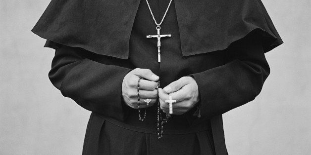 priest with crucifix