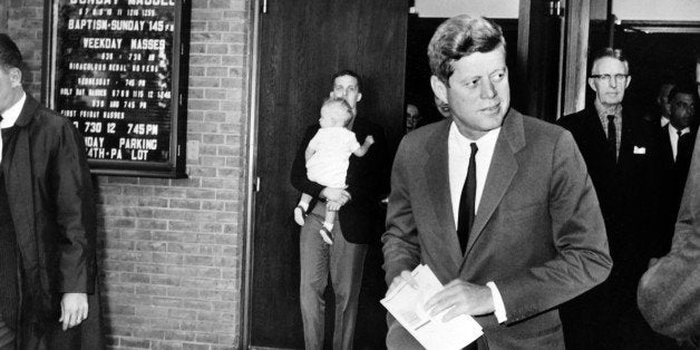 US President John Fitzgerald Kennedy leaves the Saint Stephen Martyr catholic church after attending mass, on October 28, 196