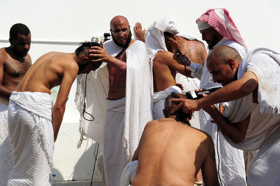 Muslim pilgrims shave their heads after