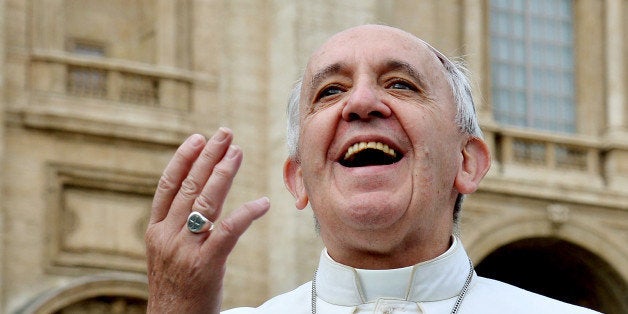 Pope Francis smiles at pilgrims in Saint Peter's square at the Vatican, during the end of his weekly general audience on Nove