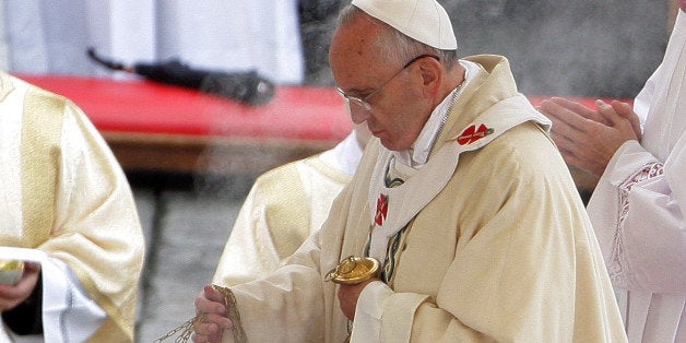 VATICAN CITY, VATICAN - NOVEMBER 24: Pope Francis waves incense as he celebrates mass during the end of the Solemnity of Christ the King in St. Peter's square on November 24, 2013 in Vatican City, Vatican. Today's solemnity of Our Lord Jesus Christ, King of the Universe, the crowning of the liturgical year, marks the conclusion of the Year of Faith proclaimed earlier by Pope emeritus Benedict XVI in the last year of his reign. (Photo by Franco Origlia/Getty Images)