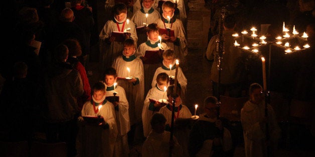 SALISBURY, ENGLAND - DECEMBER 01: Choristers carry candles through the interior of Salisbury Cathedral during the annual 'darkness to light' advent procession on December 1, 2012 in Salisbury, England. The service - which begins with the medieval cathedral in total darkness and silence before the Advent Candle is lit at the West End - is one of the most popular services of the liturgical year. The annual advent service, which takes place over three nights and is seen by several thousand people, is a mix of music and readings during which two great candlelit processions move around the different spaces in the 750-year-old building which, by the end, is illuminated by almost 1300 candles and is a spectacular start to the Christmas season. (Photo by Matt Cardy/Getty Images)