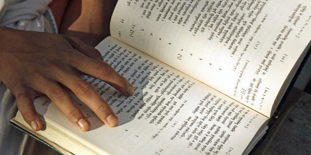 India, Young Student Of Religious Studies Memorizing Rigveda Or Vedas. (Photo by Education Images/UIG via Getty Images)