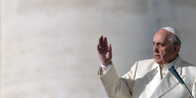 Pope Francis gives his blessing during his weekly general audience in St Peter's Square at the Vatican on January 8, 2014. AFP PHOTO/ Gabriel BOUYS (Photo credit should read GABRIEL BOUYS/AFP/Getty Images)