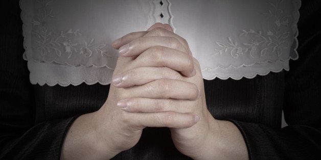 hand of nun praying