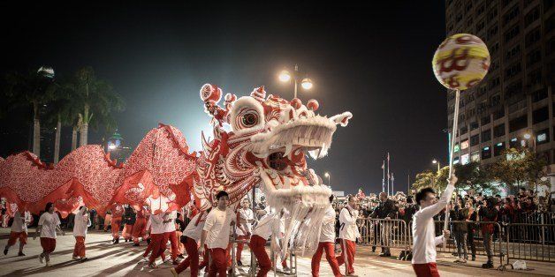 Performers display a dragon dance during a Chinese New Year parade in Hong Kong on January 31, 2014. Chinese communities across Asia have come together to usher in the Year of the Horse. AFP PHOTO/Philippe Lopez (Photo credit should read PHILIPPE LOPEZ/AFP/Getty Images)
