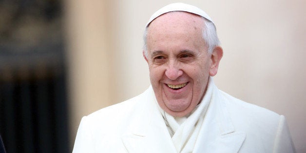 VATICAN CITY, VATICAN - JANUARY 29: Pope Francis holds his weekly audience in St. Peter's Square on January 29, 2014 in Vatican City, Vatican. After his appearance on the cover of Rolling Stone magazine, today Pontiff was also found to be represented in a graffiti in Rome that portrays him in a superhero vest. (Photo by Franco Origlia/Getty Images)