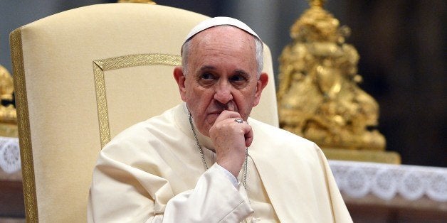 Pope Francis speaks to members of the Sri Lankan community after a mass held by the Archbishop of Colombo at St Peter's Basilica on February 8, 2014 at the Vatican. AFP PHOTO / GABRIEL BOUYS (Photo credit should read GABRIEL BOUYS/AFP/Getty Images)