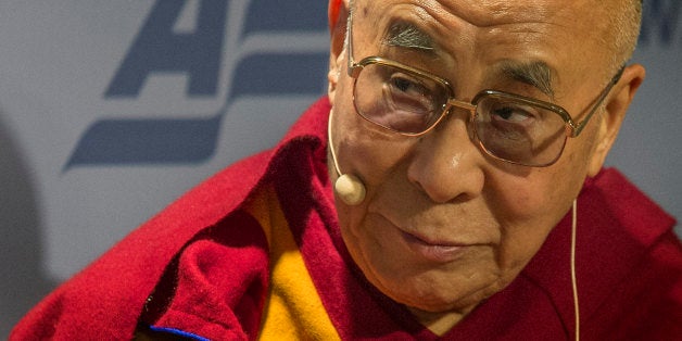 The Dalai Lama speaks at the American Enterprise Institute (AEI) during a panel discussion on 'Happiness, Free Enterprise, and Human Flourishing' in Washington, DC, February 20, 2014. AFP PHOTO / Jim WATSON (Photo credit should read JIM WATSON/AFP/Getty Images)