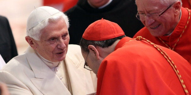 VATICAN CITY, VATICAN - FEBRUARY 22: Pope Emeritus Benedict XVI greets cardinals as he leaves the St Peter's Basilica at the end of the Consistory on February 22, 2014 in Vatican City, Vatican. 19 new cardinals have been created in a ceremony in the Vatican. (Photo by Franco Origlia/Getty Images)