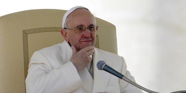 Pope Francis gestures in St.Peter's square at the Vatican during his weekly general audience on March 5, 2014. Pope Francis has defended the Catholic Church's record on tackling the sexual abuse of children by priests, saying 'no-one else has done more' to root out paedophilia. AFP PHOTO / ANDREAS SOLARO (Photo credit should read ANDREAS SOLARO/AFP/Getty Images)