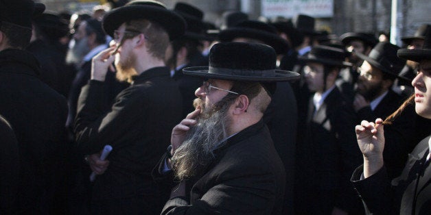 JERUSALEM, ISRAEL - FEBRUARY 12: Ultra Orthodox men pray during protest against construction at site in the town of Bet-Shem