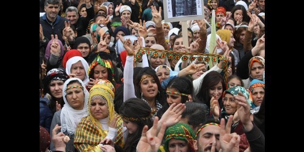 Kurds celebrate on March 17, 2013 Nowruz, the Persian New Year festival, in Ankara. The festival is celebrated in Turkey, Central Asian republics, Iraq, Iran, Azerbaijan as well as war-torn Afghanistan and coincides with the astronomical vernal equinox. AFP PHOTO/ADEM ALTAN (Photo credit should read ADEM ALTAN/AFP/Getty Images)