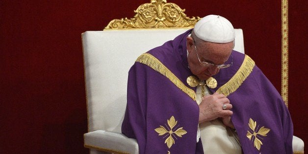 Pope Francis leads a mass at St Peter's basilica on March 28, 2014 at the Vatican. AFP PHOTO / ALBERTO PIZZOLI (Photo credit should read ALBERTO PIZZOLI/AFP/Getty Images)