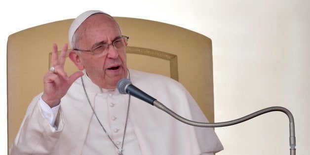 Pope Francis gestures as he speaks in St. Peter's square at the Vatican during his weekly general audience on April 2, 2014.