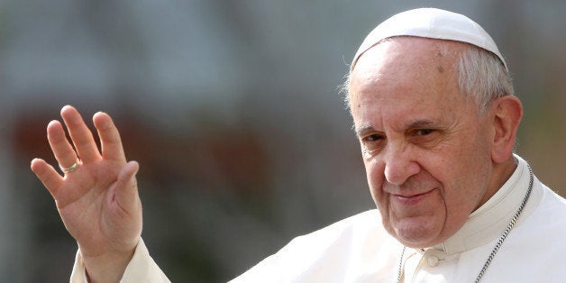 ROME, ITALY - APRIL 06: Pope Francis waves during a visit to the Roman parish of San Gregorio Magno in the popular area of 'La Magliana' on April 6, 2014 in Rome, Italy. Pope Francis prayed for the two Italian priests and for the Canadian sister kidnapped in Cameroon. (Photo by Franco Origlia/Getty Images)