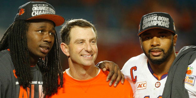 MIAMI GARDENS, FL - JANUARY 3: (L - R) Sammy Watkins #2, head coach Dabo Swinney, and Tajh Boyd #10 of the Clemson Tigers celebrate their victory against the Ohio State Buckeyes after the 2014 Discover Orange Bowl at Sun Life Stadium on January 3, 2014 in Miami, (Photo by Joel Auerbach/Getty Images)