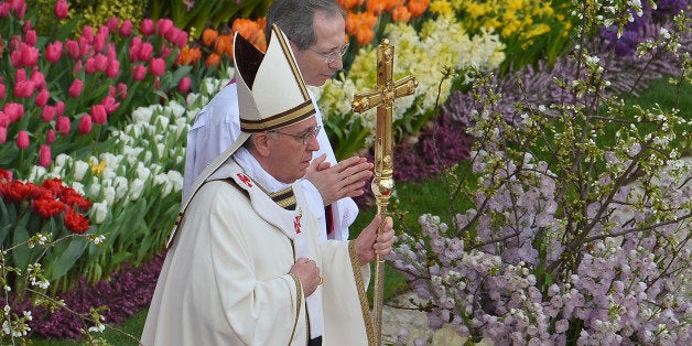 Pope Francis leads the Easter celebrations on St Peter's square on March 31, 2013 at the Vatican. Easter Sunday celebrates the Christian belief in Jesus's death and resurrection and is marked around the world, often with a variety of not strictly religious local traditions like painted eggs or Easter Bunnies. AFP PHOTO / VINCENZO PINTO (Photo credit should read VINCENZO PINTO,VINCENZO PINTO/AFP/Getty Images)