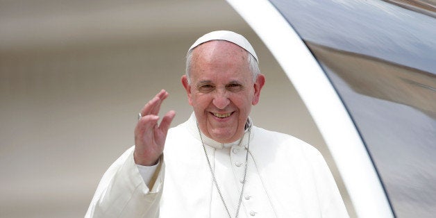 VATICAN CITY, VATICAN - APRIL 23: Pope Francis holds his weekly audience on April 23, 2014 in Vatican City, Vatican. Pilgrims have started to arrive in St. Peter's Square for the Canonization ceremony for Pope John XXIII and John Paul II, which will take place on Sunday 27th. (Photo by Giulio Origlia/Getty Images)