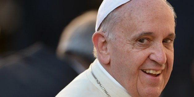 Pope Francis greets people as he arrives at the Sant' Ignazio di Loyola church on April 24, 2014 in Rome. Pope Francis leads today a mass of thanksgiving for the canonization of Father José de Anchieta, a Jesuit of the '500 strongly linked to evangelization in Brazil. AFP PHOTO / FILIPPO MONTEFORTE (Photo credit should read FILIPPO MONTEFORTE/AFP/Getty Images)