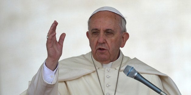 Pope Francis blesses the crowd at the end of his general audience at St Peter's square, on April 30, 2014 at the Vatican. AFP PHOTO / VINCENZO PINTO (Photo credit should read VINCENZO PINTO/AFP/Getty Images)