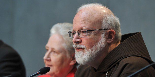 Members of the anti-pedophilia Pontifical commission, US Cardinal Sean Patrick O'Malley (R) and Irish Marie Collins attend a press conference on May 3, 2014 at the Vatican. AFP PHOTO / TIZIANA FABI (Photo credit should read TIZIANA FABI/AFP/Getty Images)