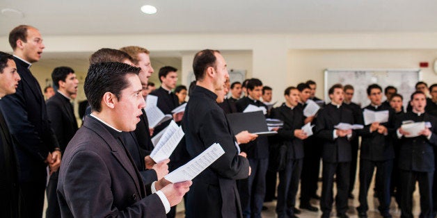 ROME, ITALY MAY 5 :Priest that are students of the Pontifical Athenaeum Regina Apostolorum are seen chanting during classes break while the Exorcism and Prayer of Liberation annual conference is taking pace at the Pontifical Athenaeum Regina Apostolorum on May 5, 2014 in Rome. ItalyExorcists from all over the world arrived in Rome to attend their annual conference. (Photo By Marco Di Lauro/Reportage by Getty Images for The Washington Post via Getty Images)