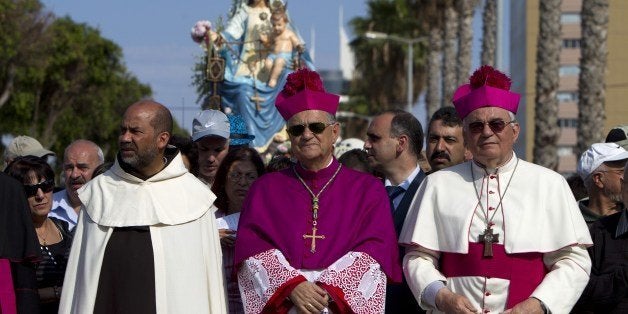 The Latin Patriarch of Jerusalem and Head of the Roman Catholic Church in the Holy Land, Fuad Twal, takes part in a march in the northern Israeli city of Haifa on May 11, 2014. Twal said that Israeli hate crimes against local Muslims and Christians are souring relations ahead of a papal visit. AFP PHOTO/AHMAD GHARABLI (Photo credit should read AHMAD GHARABLI/AFP/Getty Images)