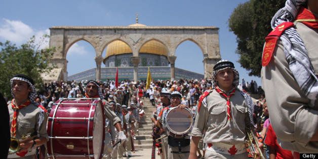 Palestinian scouts take part in celebrations marking the Muslim holiday 'Israa and Miraj', the day on which, according to tradition, the prophet Mohammed left Mecca for Jerusalem, from where he ascended to heaven, on July 30, 2008 at the Al-Aqsa Mosque compound in Jerusalem. AFP PHOTO/AHED IZHIMAN (Photo credit should read AHED IZHIMAN/AFP/Getty Images)