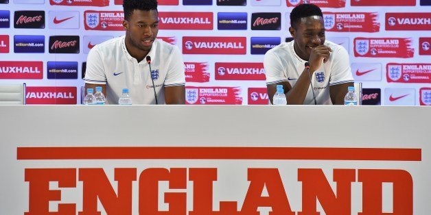 England's forward Daniel Sturridge (L) and England's forward Daniel Welbeck react during a press conference at the Urca milit