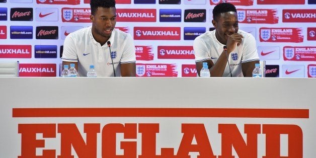 England's forward Daniel Sturridge (L) and England's forward Daniel Welbeck react during a press conference at the Urca military base in Rio de Janeiro on June 16, 2014, ahead of their next World Cup Brazil 2014 Group D football match against Uruguay at Corinthians Arena in Sao Paulo on June 19, 2014. AFP PHOTO/ BEN STANSALL (Photo credit should read BEN STANSALL/AFP/Getty Images)