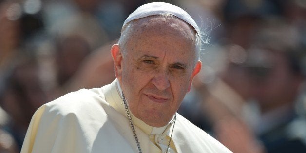 Pope Francis looks on during his general audience at St Peter's square on June 11, 2014 at the Vatican. AFP PHOTO / VINCENZO PINTO (Photo credit should read VINCENZO PINTO/AFP/Getty Images)