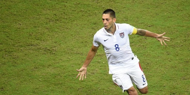 US forward Clint Dempsey celebrates after scoring during a Group G football match between USA and Portugal at the Amazonia Ar