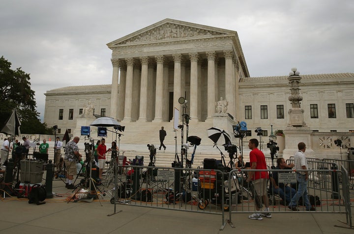 WASHINGTON, DC - JUNE 30: Media of the media are set up in front of the U.S. Supreme Court, June 30, 2014 in Washington, DC. Today the high court is expected to give its ruling on whether a private company can be exempted on religious grounds from health care reform's requirement that employer sponsored health insurance policies cover contraception. (Photo by Mark Wilson/Getty Images)