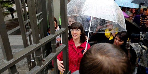 SALT LAKE CITY, UT - APRIL 5: Kate Kelly (C), founder of 'Ordain Women' opens the closed east gates to Temple Square along with 500 supporters on April 5, 2014 in Salt Lake City, Utah to request entrance to the Mormon churches all male priesthood session. The group organized to ask the leaders of the The Church of Jesus Christ of Latter Day Saints, Mormons, to open up their all male priesthood to women ordination and leadership. (Photo by George Frey/Getty Images