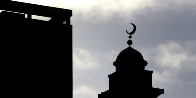 A general view a Mosque in Rochdale which stands alongside high rise flats in the town, as a review after nine Asian men were