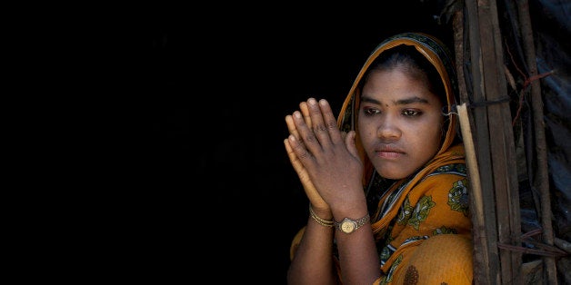 SHAMALAPUR, BANGLADESH - APRIL 11: Rajama sits in the doorway of her home in the Shamalapur Rohingya refugee settlement on April 11, 2014 in Chittagong district, Bangladesh. She fled to Bangladesh 5 months ago from the Dhuachopara village in the Rachidhong district of Myanmar. The Chakma people came on a Friday during prayer time in a giant mob and started burning houses and burning people alive. They beat her father and brother, and then they opened fired and started shooting and killing people at random. A group of people fled to the mosque and the Chakma followed, opening fire inside. Her father fled to the ocean and escaped to Bangladesh by boat. Rajama came to Bangladesh 3 days after the riot to find her father. When she arrived in the port of Teknaf the dock workers held her captive for 3 days with no food or water. They beat her and abused her before letting her go. She has 7 siblings back in Myanmar who were not able to escape. 'I miss my family, but how can I miss them? I want to live.' she says. Last week Tomas Ojea Quintana, the UN special rapporteur on Human Rights, said that recent developments in Myanmar's Rakhine state were the latest in a 'long history of discrimination and persecution against the Rohingya Muslim community which could amount to crimes against humanity', and that the Myanmar government's decision not to allow Rohingya Muslims to register their ethnicity in the March census meant that the population tally was not in accordance with international standards. Over the years hundreds of thousands of Rohingya refugees have taken refuge in Bangladesh to escape the deadly sectarian violence in Myanmar. (Photo by Getty Images/Getty Images)