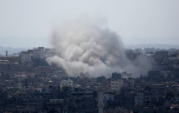 Smoke rises after an Israeli missile strike in Gaza City,  Monday, July 14, 2014.