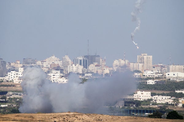 A picture taken on July 14, 2014 from the southern Israeli Gaza border shows an Israeli army flare falling into the Palestini