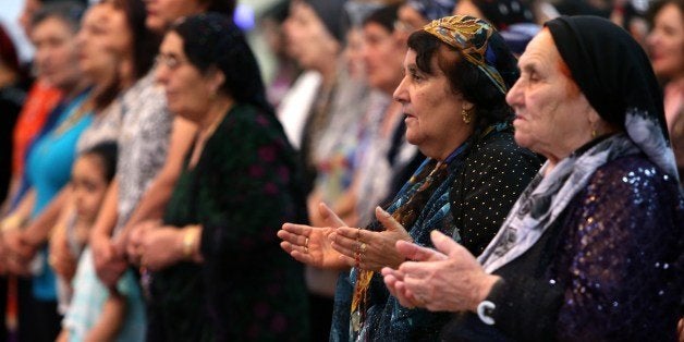 Iraqi Christians pray during a mass at the Saint-Joseph church in Arbil, the capital of the autonomous Kurdish region of northern Iraq, on July 20, 2014. Hundreds of Christian families fled their homes in Mosul on July 20, 2014 as a jihadist ultimatum threatening their community's centuries-old presence in the northern Iraqi city expired. AFP PHOTO / SAFIN HAMED (Photo credit should read SAFIN HAMED/AFP/Getty Images)