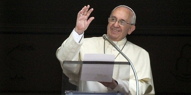 Pope Francis gestures as he delivers a speech from the window of his apartment during his Sunday Angelus prayer in St. Peter's Square at the Vatican on July 27, 2014. AFP PHOTO / ANDREAS SOLARO (Photo credit should read ANDREAS SOLARO/AFP/Getty Images)