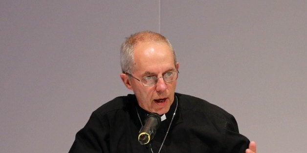 Archbishop of York John Sentamu (R) and Archbishop of Canterbury Justin Welby (L) speak at a press conference after members of the Church of England General Synod voted to allow female bishops in York, northern England, on July 14, 2014. The Church of England overcame bitter divisions on July 14 to vote in favour of allowing female bishops for the first time in its nearly 500-year history. The decision reverses a previous shock rejection in 2012 and comes after intensive diplomacy by Archbishop of Canterbury, Justin Welby. AFP PHOTO / LINDSEY PARNABY (Photo credit should read LINDSEY PARNABY/AFP/Getty Images)