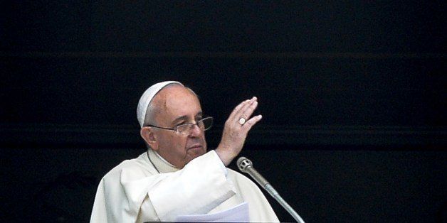 Pope Francis gestures as he delivers a speech from the window of his apartment during his Sunday Angelus prayer in St. Peter's Square at the Vatican on July 27, 2014. AFP PHOTO / ANDREAS SOLARO (Photo credit should read ANDREAS SOLARO/AFP/Getty Images)